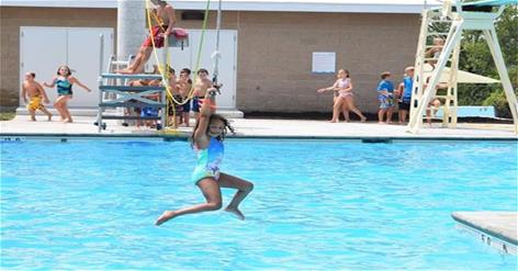 Little girl zip lining