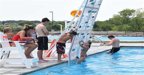 Girl climbing rock wall