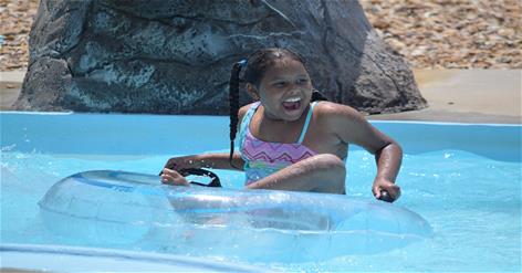 Big smile on girl in lazy river